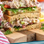 Pinterest graphic for Tuna Salad recipe. Image shows a stack of Tuna Salad sandwiches. Text says, "Tuna Salad simplejoy.com"