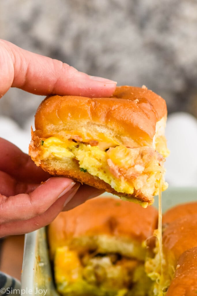 Side view of person's hand holding Breakfast Slider