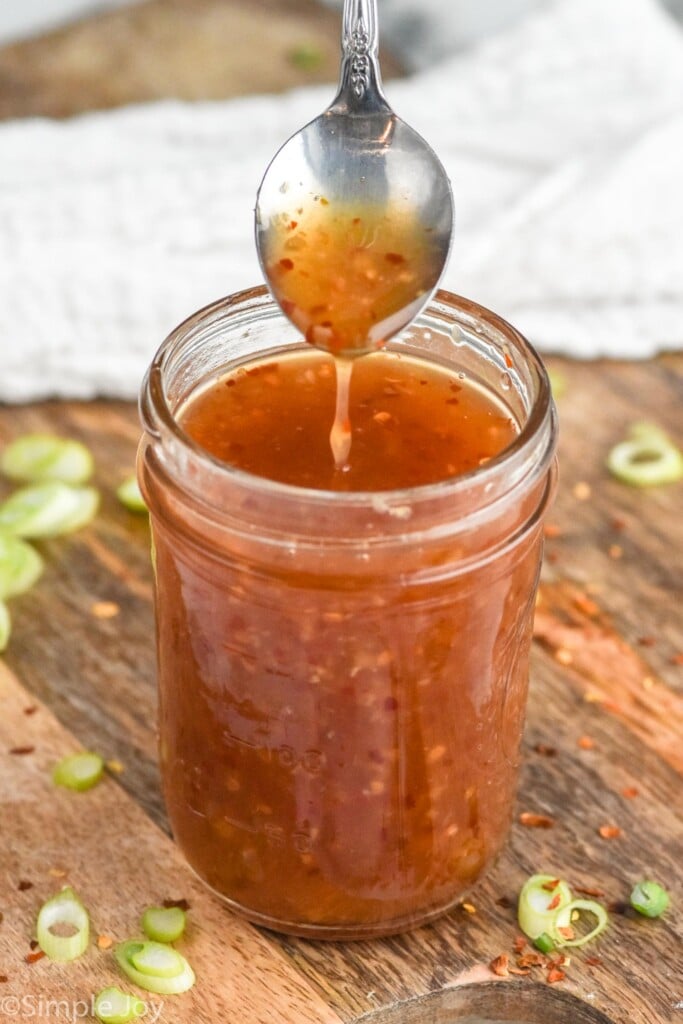 Spoon over jar of Chili Sauce