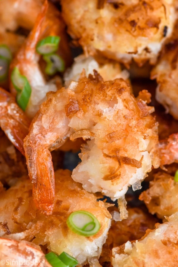 Close up photo of Coconut Shrimp garnished with green onions