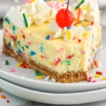 Pinterest graphic for Birthday Cheesecake recipe. Image shows slice of Birthday Cheesecake with a cherry on top and sprinkles beside. Text says, "the best Birthday Cheesecake simplejoy.com"