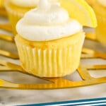 Pinterest graphic for Lemon Buttercream Frosting. Image shows cupcakes with Lemon Buttercream Frosting and lemon slice garnish. Text says "lemon frosting simplejoy.com"