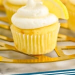 Pinterest graphic for Lemon Buttercream Frosting. Image shows cupcakes with Lemon Buttercream Frosting and lemon slice garnish. Text says "lemon frosting simplejoy.com"