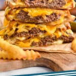 Pinterest graphic for Patty Melt. Image shows a stack of patty melt sandwiches with french fries sitting in front. Text says "patty melt simplejoy.com"