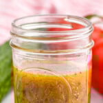 Pinterest graphic for simple vinaigrette. Text says "the best simple vinaigrette simplejoy.com" Image shows a jar of simple vinaigrette