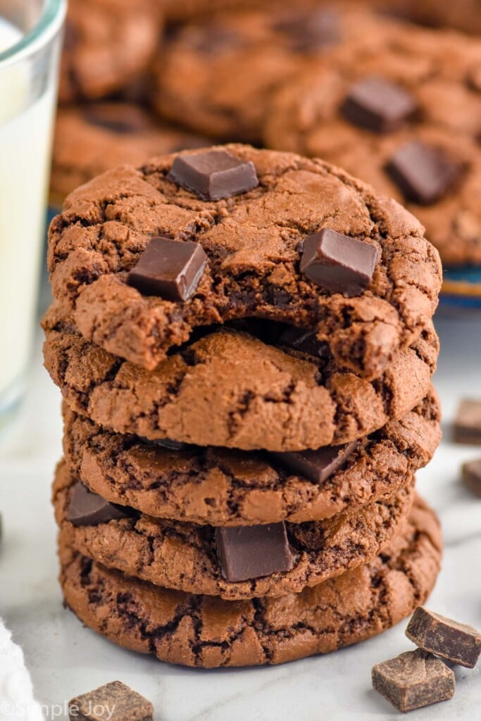 Stack of Triple Chocolate Cookies with a bite taken out of the top bite