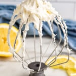 beaters with Lemon Buttercream Frosting. Lemon slices sitting in front and behind. - 8