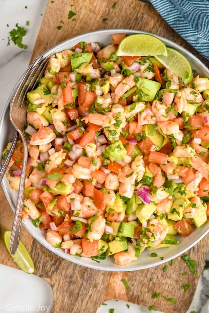 overhead of bowl of Shrimp Avocado Salad with a fork