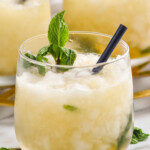 three glasses of mint julep with crushed ice, fresh mint and a straw - 8