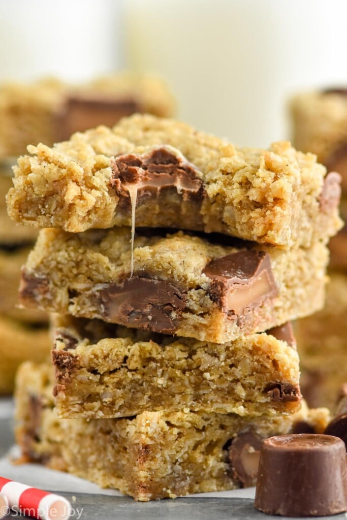 stack of oatmeal rolo bars with a bite missing from the top one