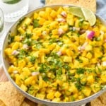 Bowl of Pineapple Mango Salsa with chips beside