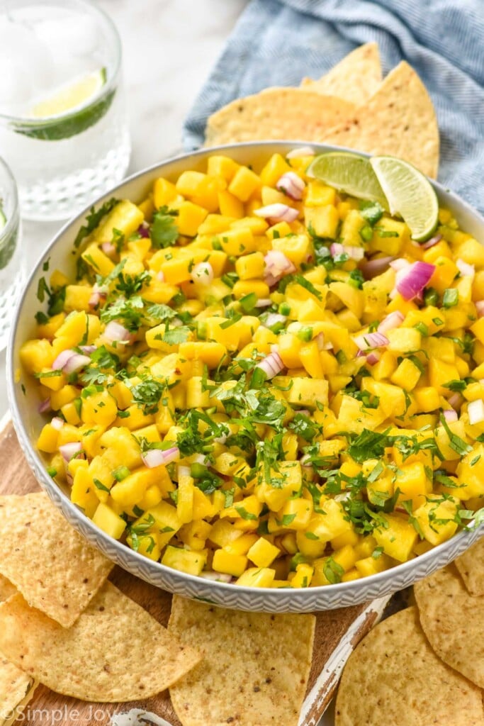 Bowl of Pineapple Mango Salsa with chips beside