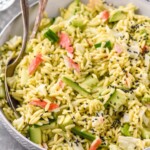 bowl of California Roll Pasta Salad with two spoons for serving - 6