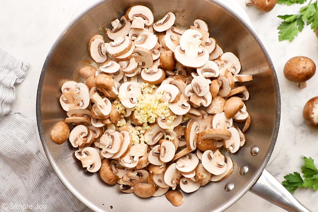 mushrooms and garlic in a pan to saute