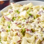 Pinterest graphic for potato salad. Text says "the best Potato Salad simplejoy.com" Image shows bowl of Potato Salad.