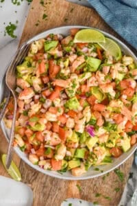 overhead of bowl of Shrimp Avocado Salad with a fork