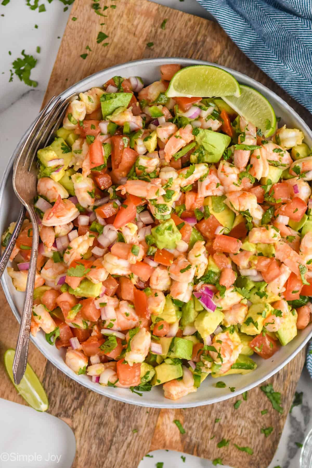 overhead of bowl of Shrimp Avocado Salad with a fork
