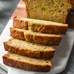 sliced loaf of Zucchini Bread on a cutting board - 10