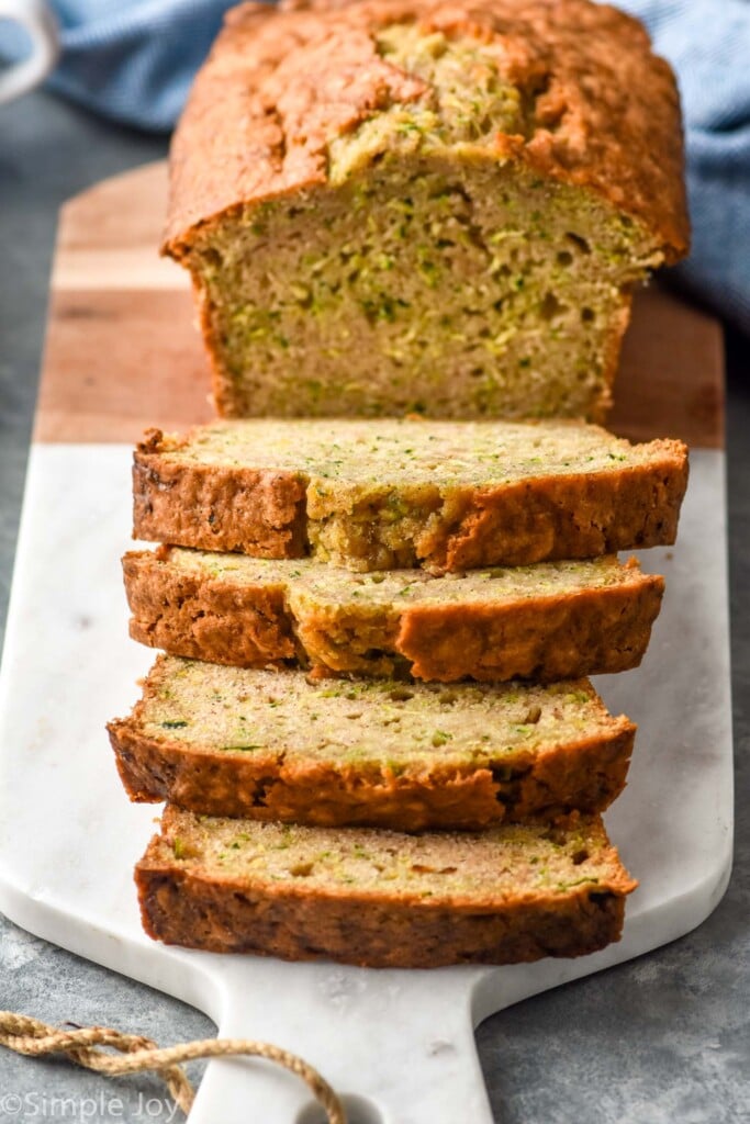 sliced loaf of Zucchini Bread on a cutting board
