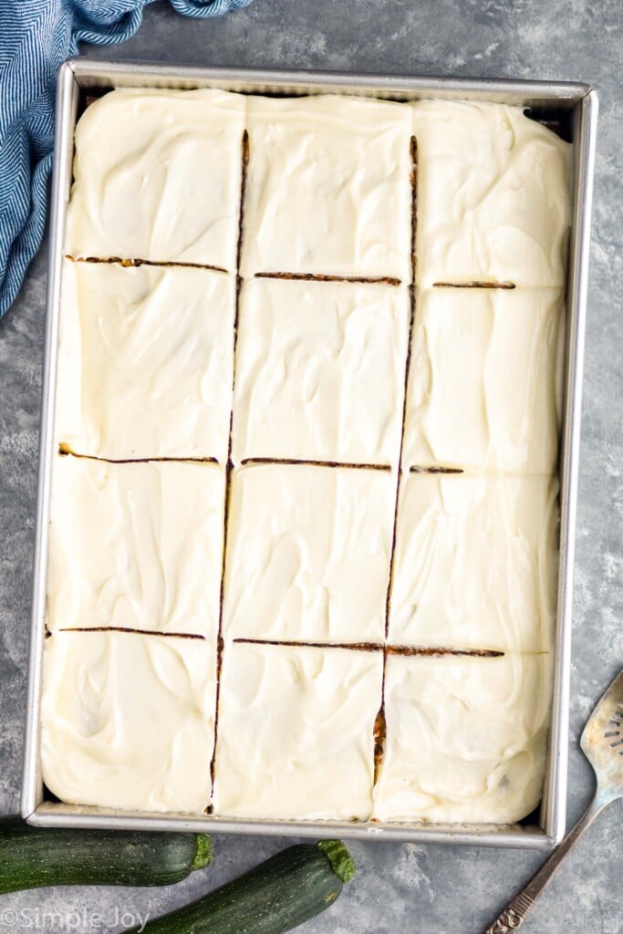 Overhead view of Zucchini Cake frosted and cut into squares