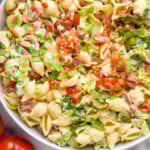 Pinterest graphic for BLT Pasta Salad. Image shows overhead of bowl of BLT Pasta Salad. Text says "the best BLT Pasta Salad simplejoy.com"