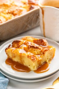 Piece of Bread Pudding with sauce served on plate. - 14