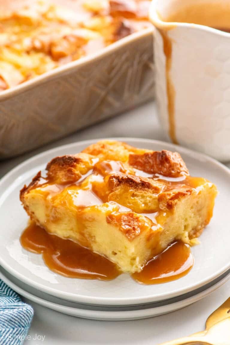 Piece of Bread Pudding with sauce served on plate.