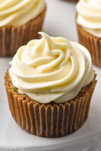 a cupcake with a swirl of cream cheese frosting on it