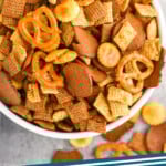 pinterest graphic of overhead view of bowl of homemade Chex mix, says: the best Chex mix simplejoy.com