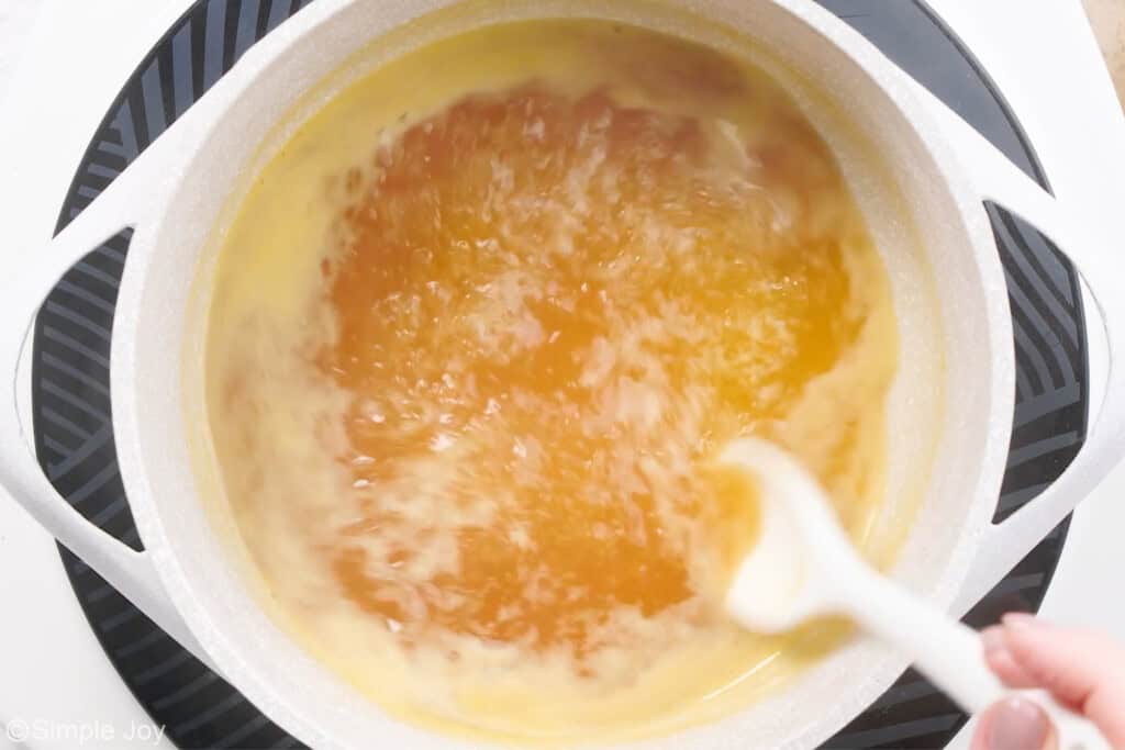 overhead of a small saucepan with glaze for a fruit salad simmering
