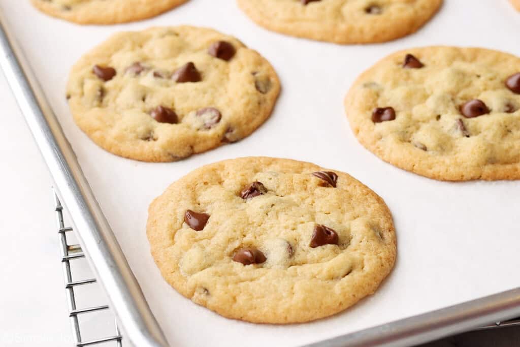 homemade chocolate chip cookies cooling on a baking sheet