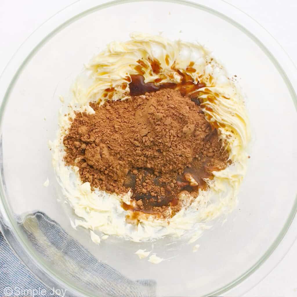 cocoa powder and vanilla extract added to butter to make chocolate frosting