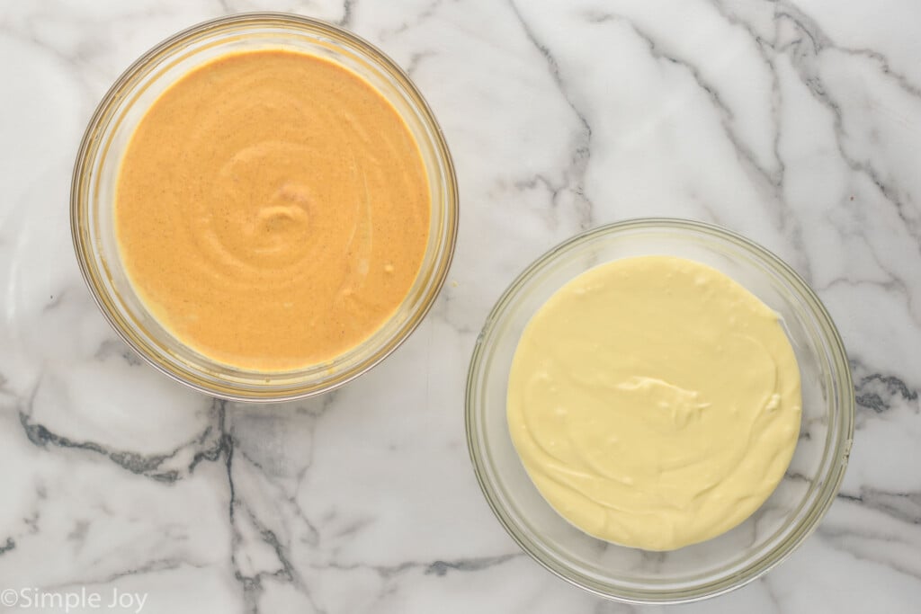 overhead of two glass bowls of cheesecake filling to make Pumpkin Cheesecake Bars - 7