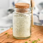 Jar of Homemade Ranch Seasoning with a lid and small wooden spoon. - 10