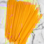 overhead of dry spaghetti sitting on the counter - 9