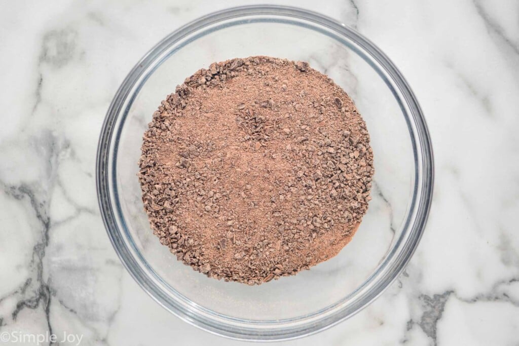 Overhead of glass bowl of chopped chocolate to make Chocolate truffles