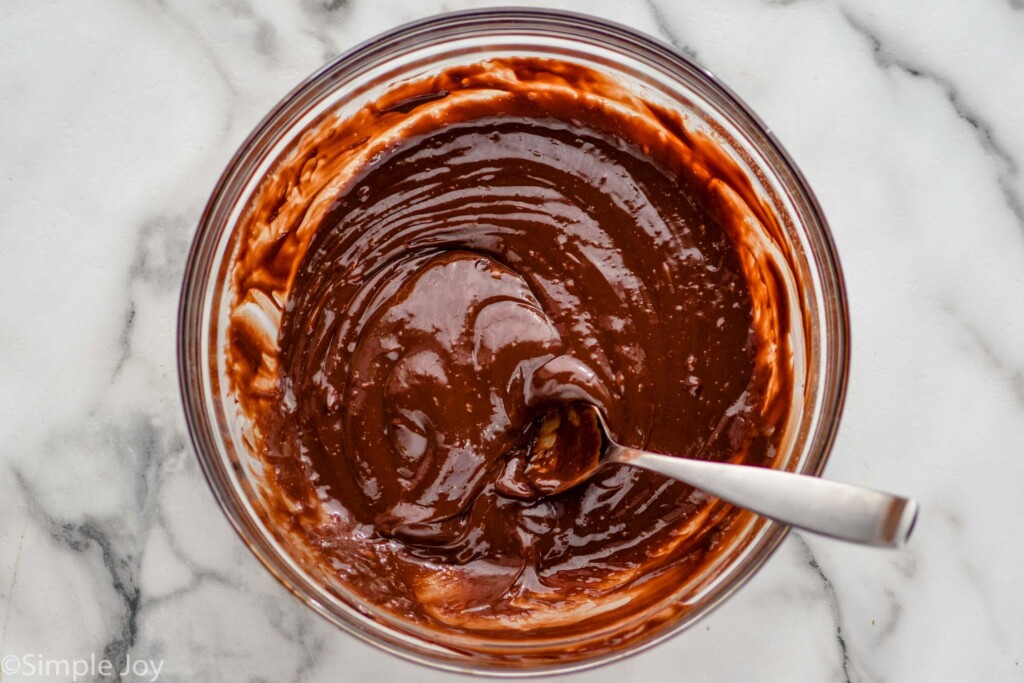 overhead of glass bowl of ingredients and spoon to make Chocolate truffles