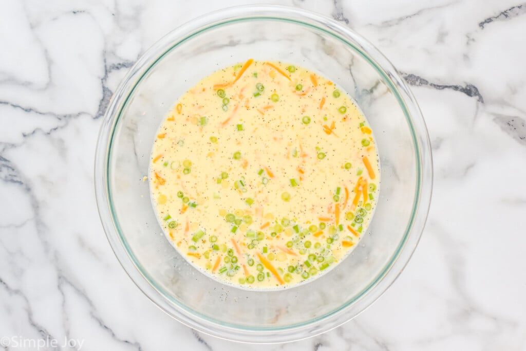 overhead of a mixing bowl full of quiche filling