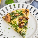 a piece of crustless spinach quiche on a white plate - 19