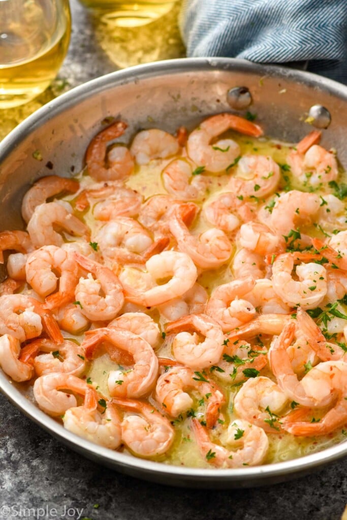 skillet of Garlic butter shrimp with sauce and fresh parsley - 2