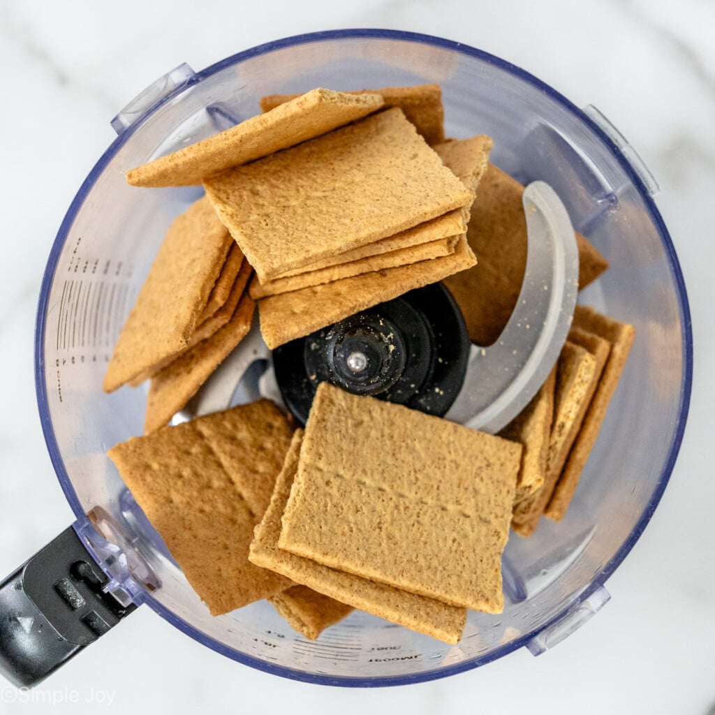 overhead of graham cracker sheets in a food processor - 6