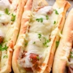 Close up photo of meatball sub sandwiches on a baking sheet - 9