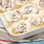 pinterest graphic for homemade cinnamon rolls. Image shows a baking dish of homemade cinnamon rolls topped with icing. Says "cinnamon rolls simplejoy.com"