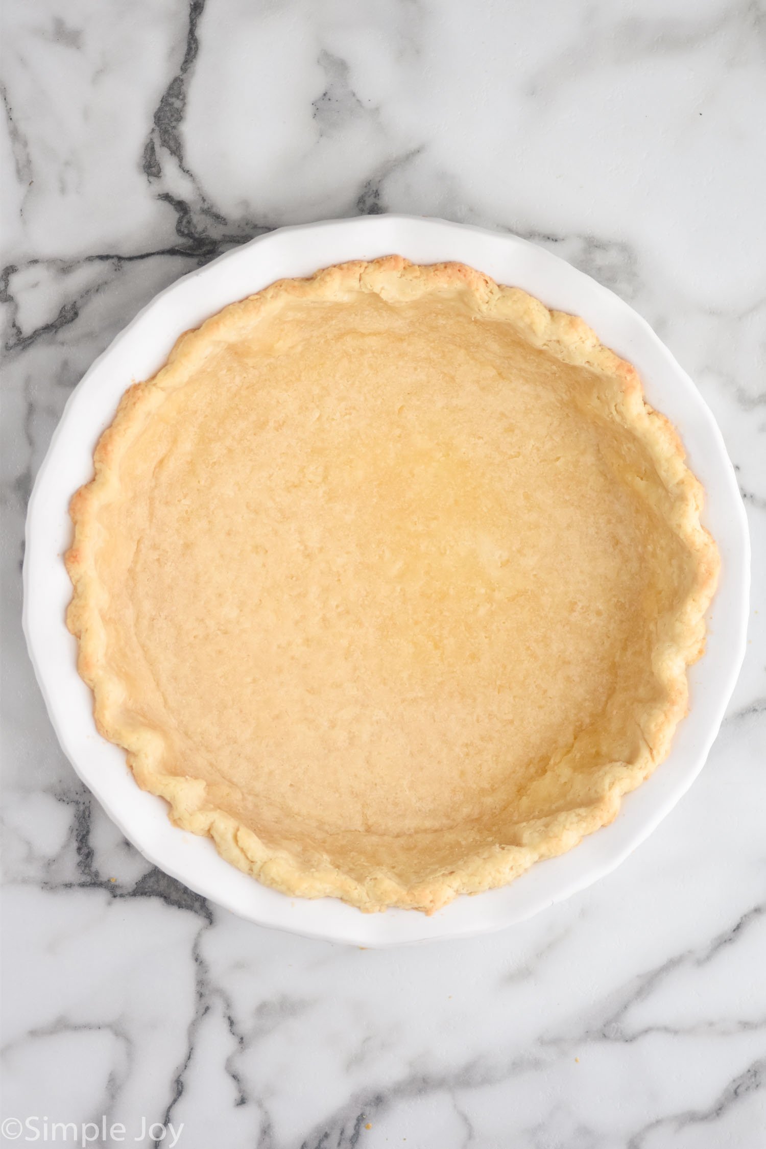 Overhead view of baked blind bake pie crust
