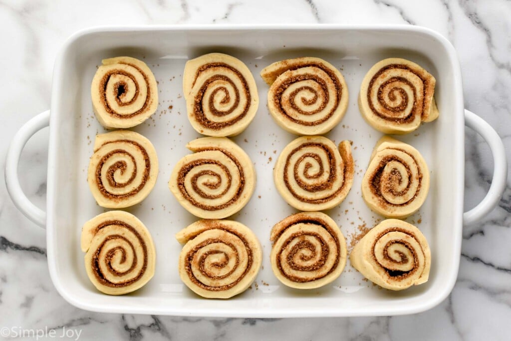overhead of homemade cinnamon rolls in a baking dish