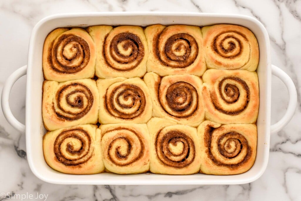 overhead of baking dish of baked homemade cinnamon rolls