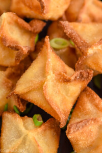 Close up view of Crab Rangoon with sliced green onions