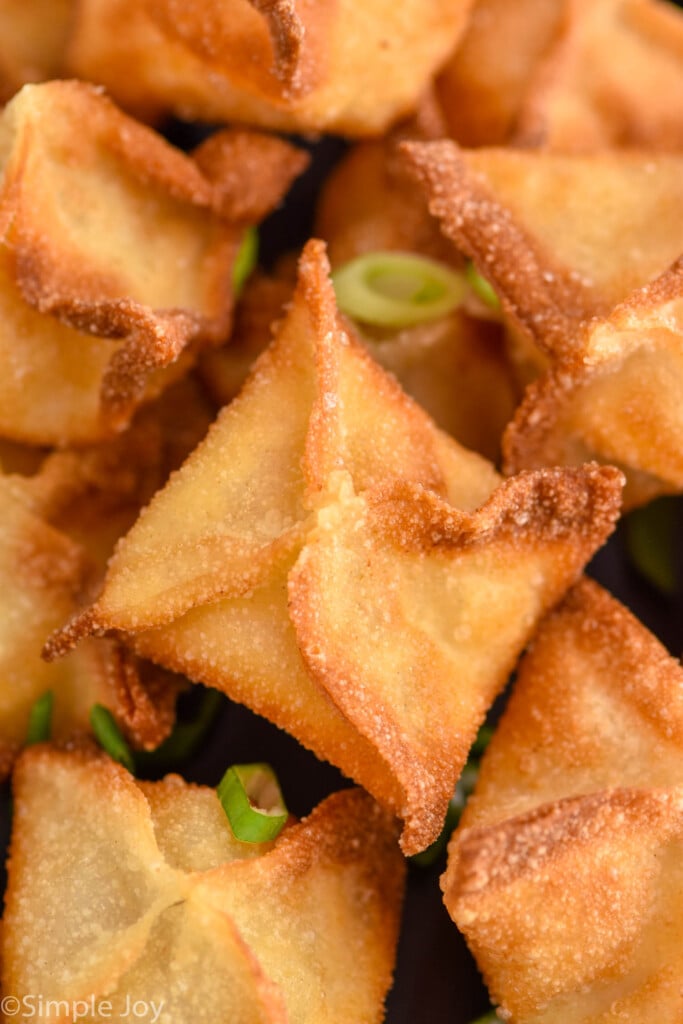 Close up view of Crab Rangoon with sliced green onions
