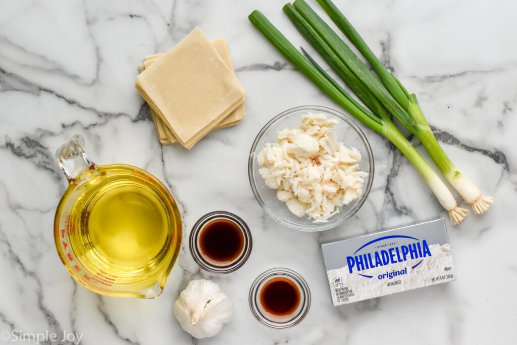 Overhead view of ingredients for Crab Rangoon recipe on countertop.