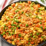 a serving bowl full of easy fried rice recipe - 9